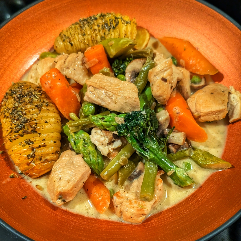 Chicken Blanquette with Spring Vegetables and Hasselback Potatoes