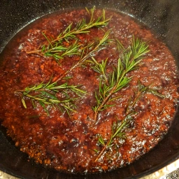 red wine reduction with sprigs of rosemary