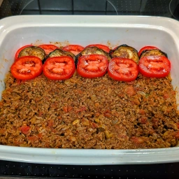 Arrange eggplants and tomatoes