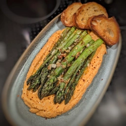 Green asparagus on feta cream