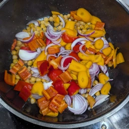 Add the onion, garlic, bell pepper and carrot to the chickpeas