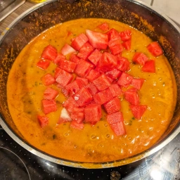 Curry sauce with watermelon cubes