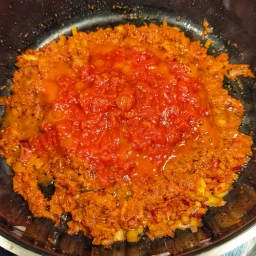 Onion, garlic, ginger, tomato paste, red curry paste and chopped tomatoes