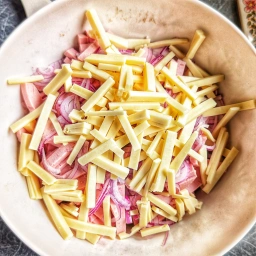 Onion, German-style bologna sausage, gherkins and Emmental cheese