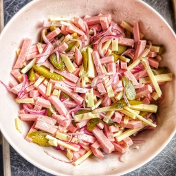 Onion, German-style bologna sausage, gherkins and Emmental cheese, well mixed