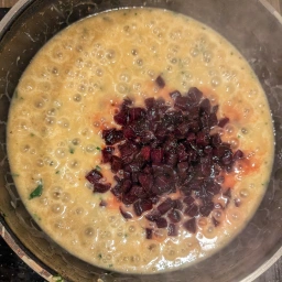 Adding the beetroot to the risotto
