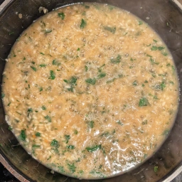 Adding the parsley to the risotto