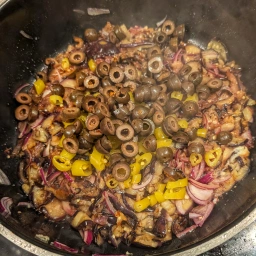Aubergines with onions, olives and peppers