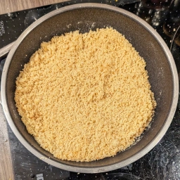 Mixing breadcrumbs with butter