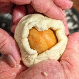 Wrapping the apricot in dough