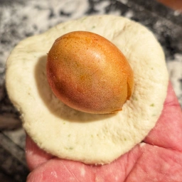 Placing the apricot on the dough disc