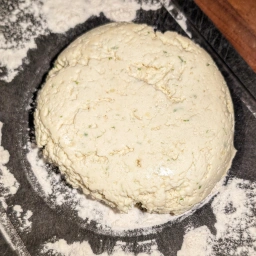 Turning the dough out onto a floured surface