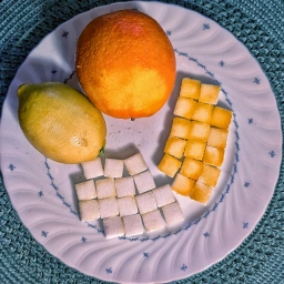 Zuckerwürfel mit Orangen- und Zitronenabrieb